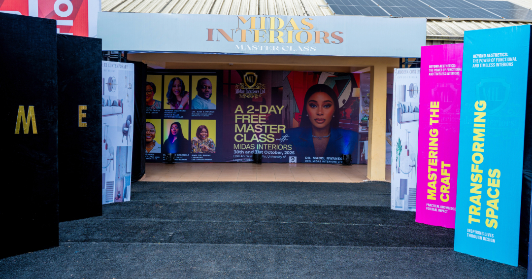 Entrance to Midas Interiors Masterclass event with promotional banners and photos of speakers displayed inside.